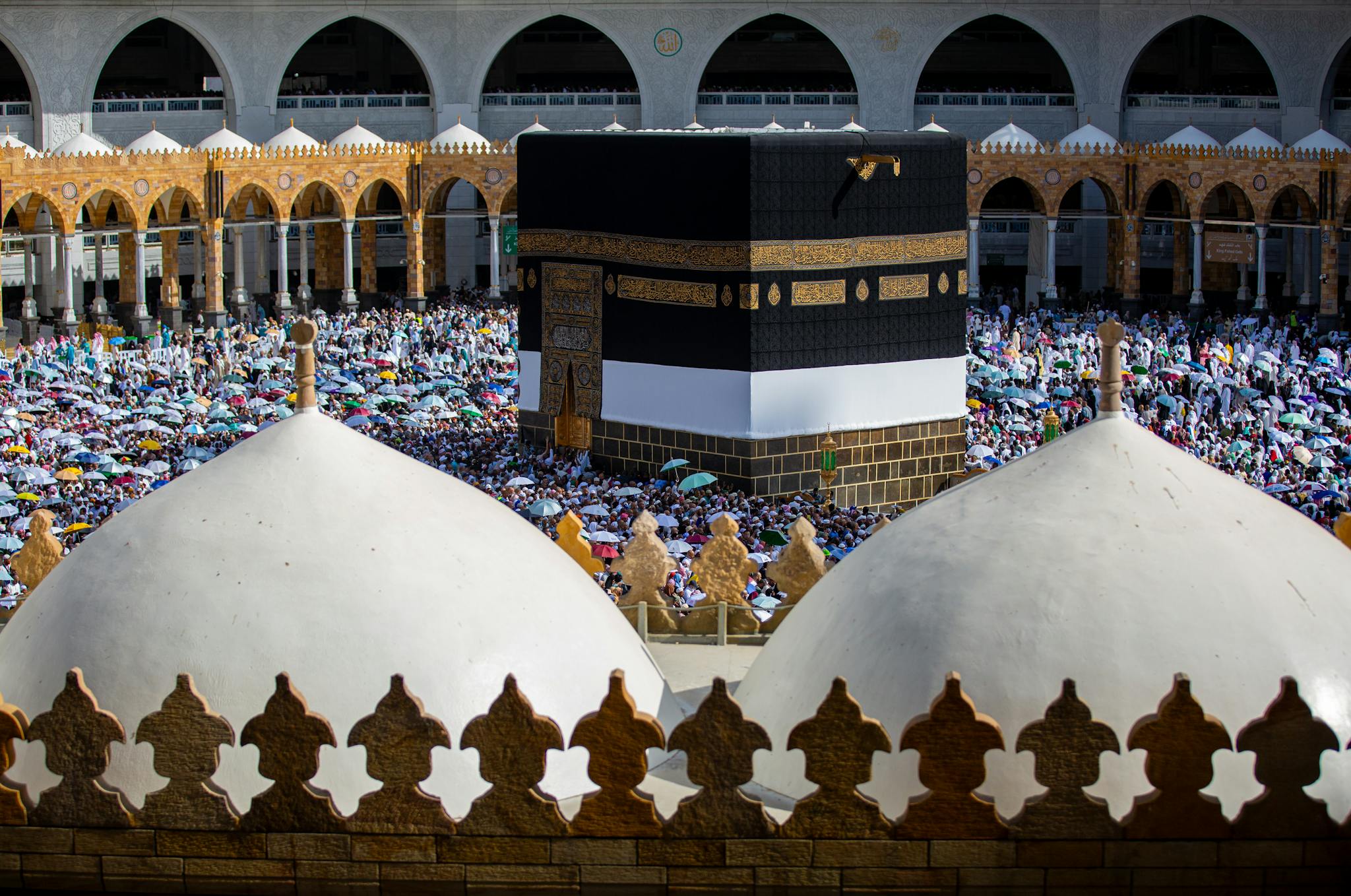 Crowds of pilgrims gather around the Kaaba in Mecca, Saudi Arabia during a religious event.